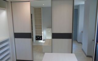 Réalisation complète d’un dressing avec coin buanderie par Profil Aménagement